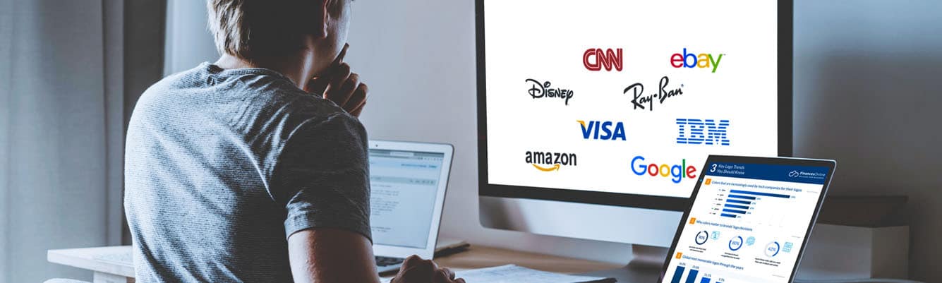 A man is looking for on his computer the best logo design trends