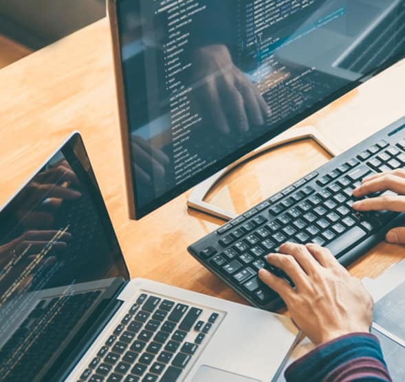 Someone is programming with codes on his computer to do web development for Mauritius website